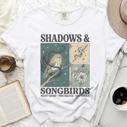 White Comfort Colors t-shirt with "Shadows & Songbirds" graphic and snake, bird, dagger, and flowers.