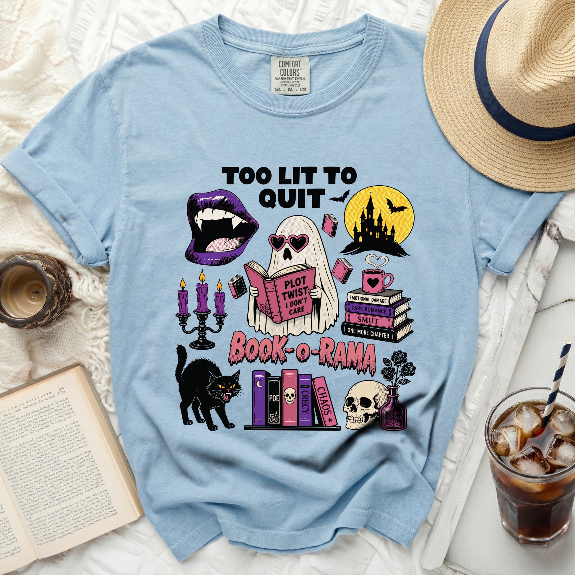 Light blue t-shirt with "Too Lit To Quit" and "Book-o-Rama" Halloween bookshelf graphic.