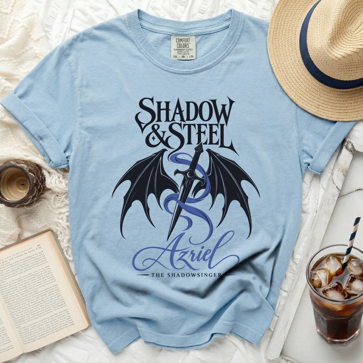 Light blue t-shirt with "Shadow & Steel Azriel The Shadowsinger" graphic.