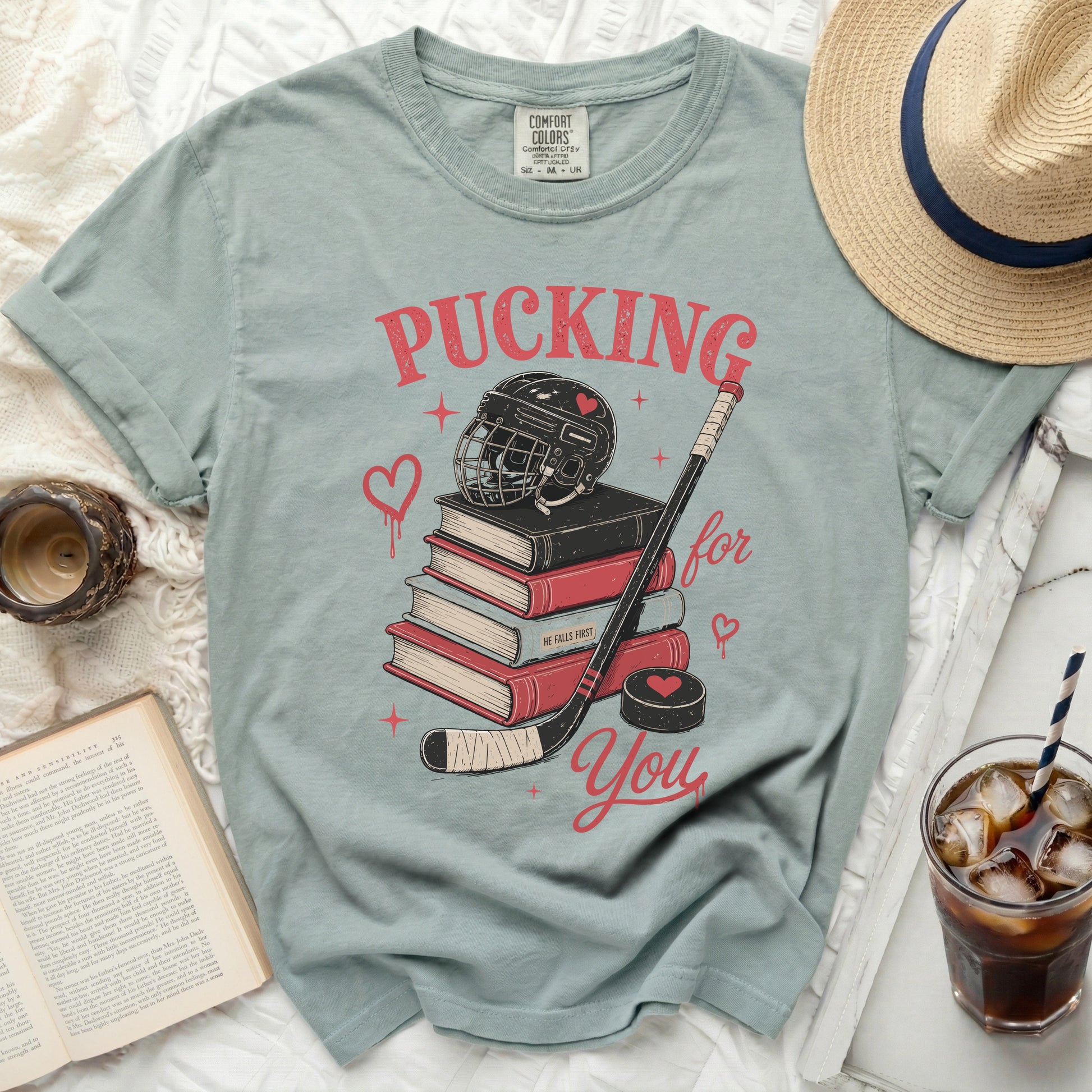 T-shirt with "Pucking for You" text over hockey gear.