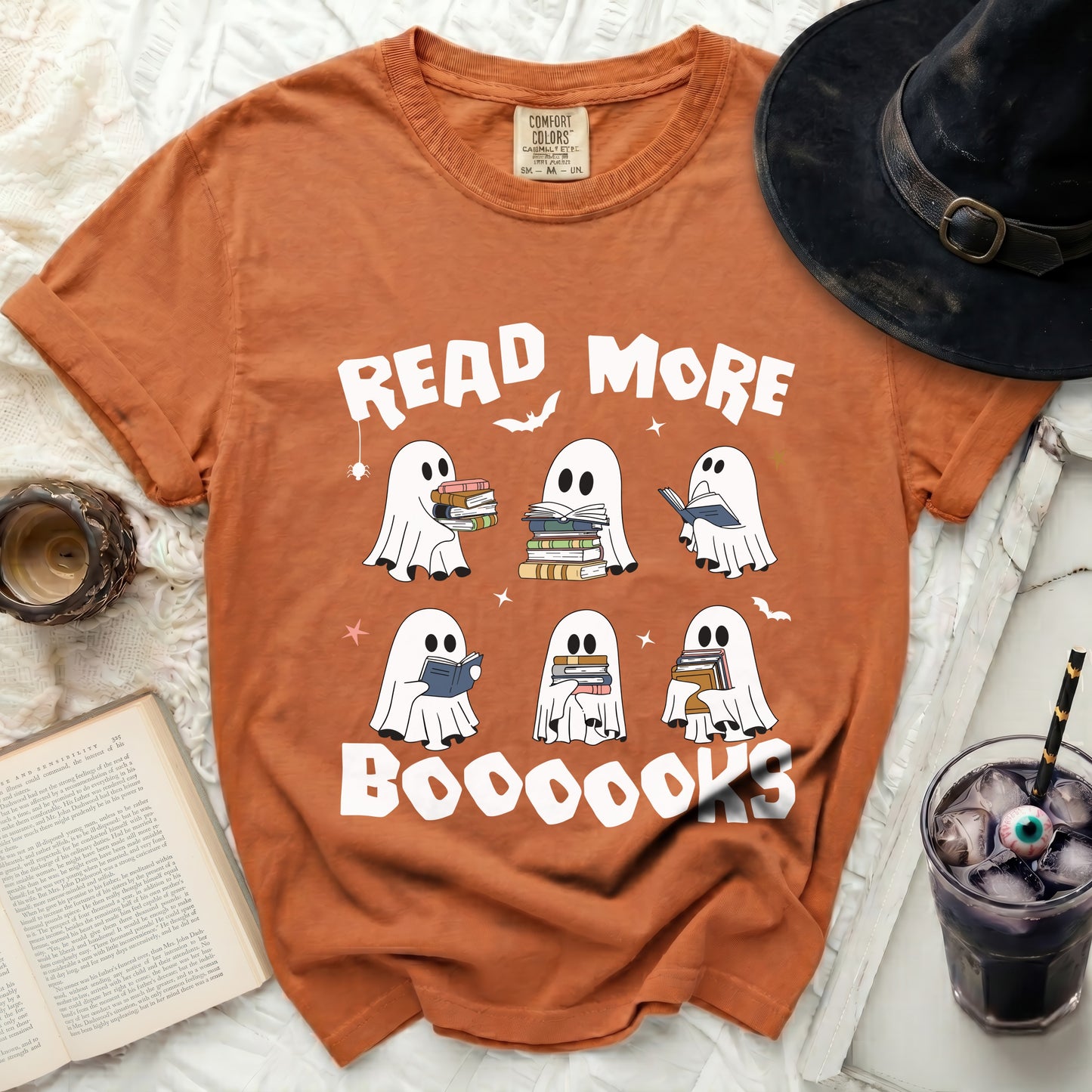 Orange shirt with ghosts reading and "Read More BOOOOOKS" graphic.