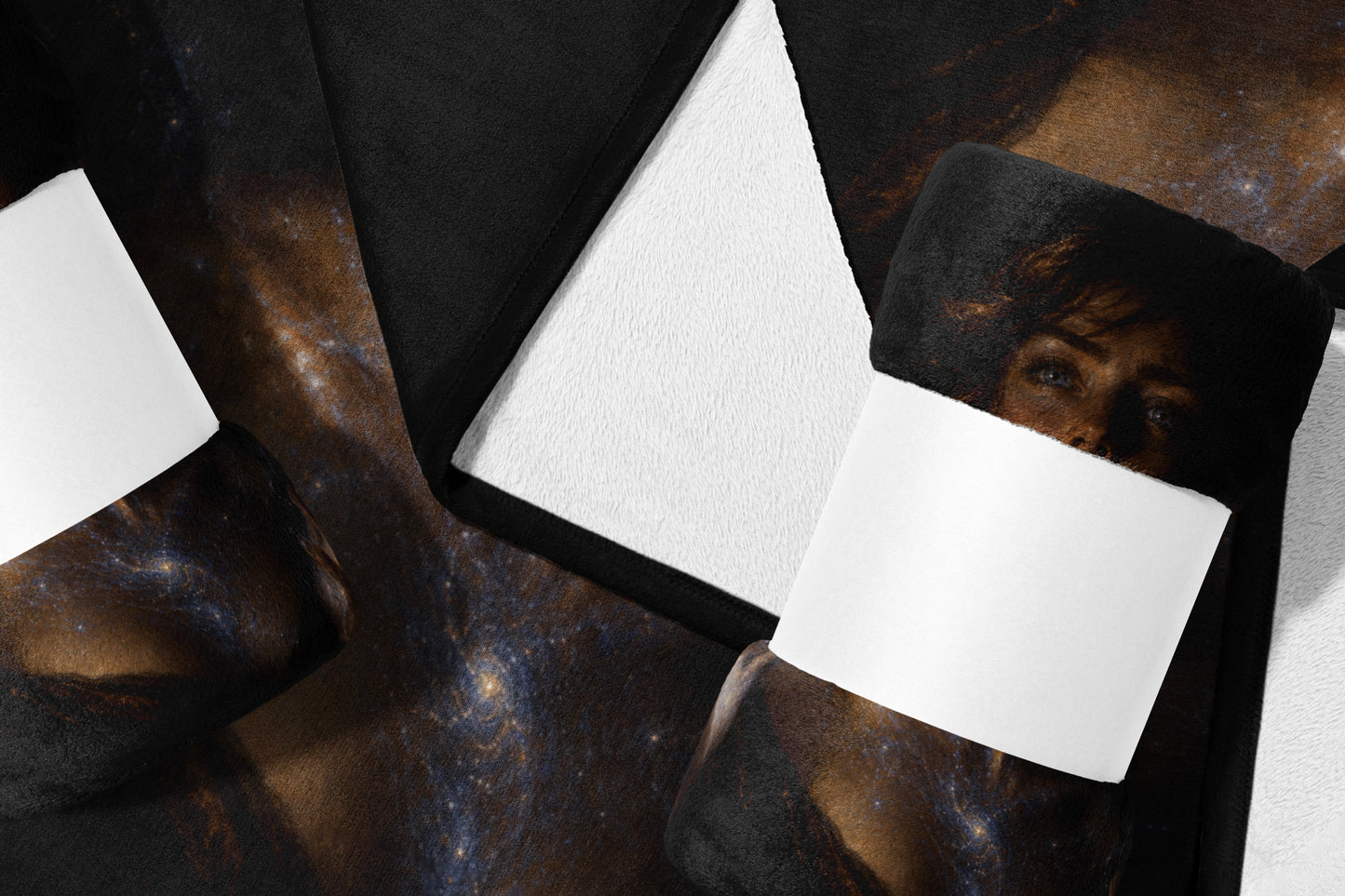Fleece blanket with a cosmic galaxy print and a folded corner revealing white backing.