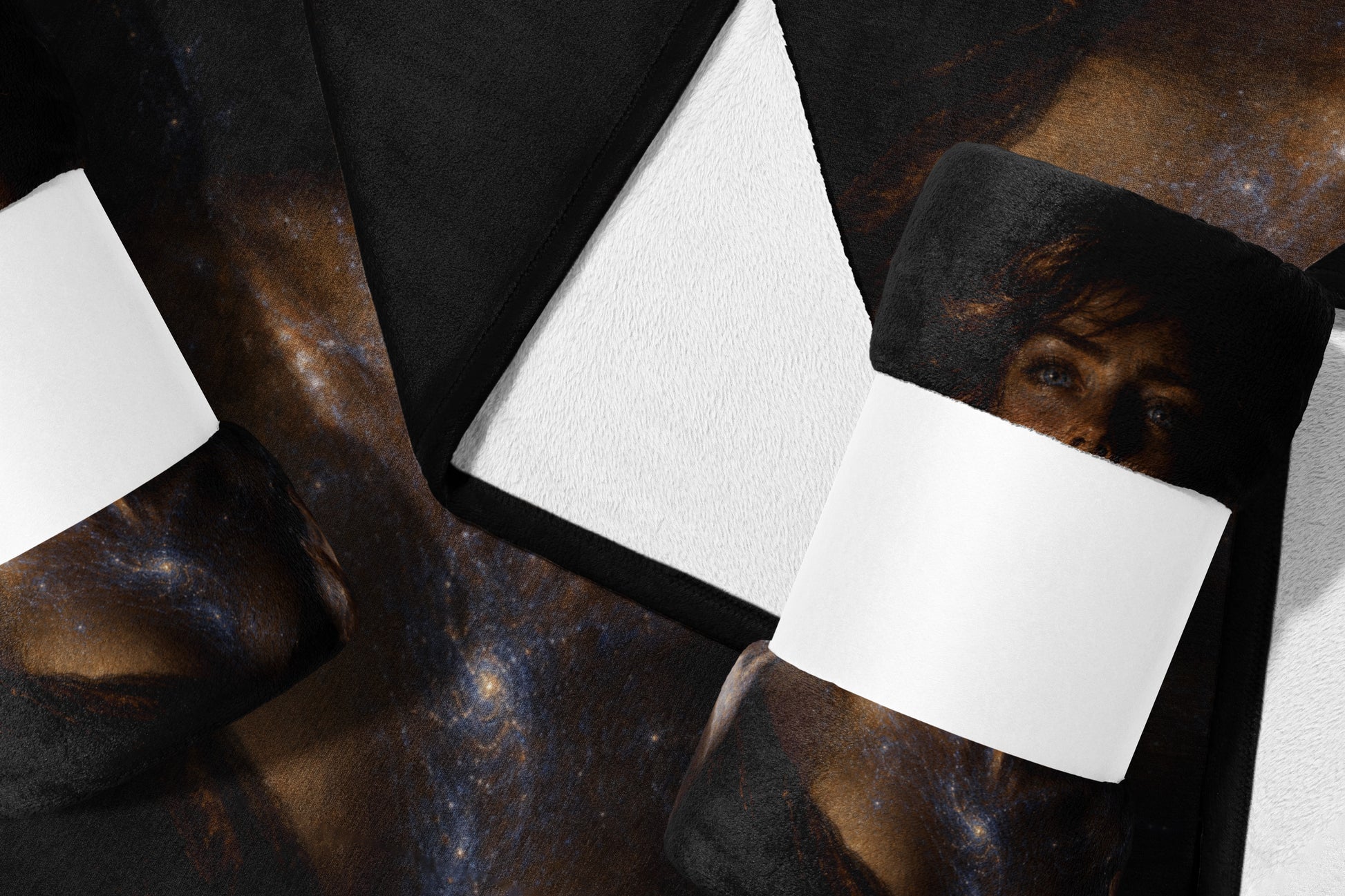 Fleece blanket with a cosmic galaxy print and a folded corner revealing white backing.