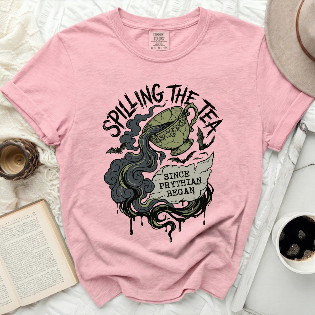 Pink t-shirt with "Spilling the Tea Since Phyrian Began" graphic.
