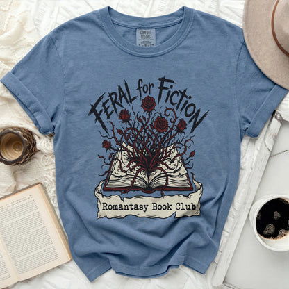 Blue t-shirt with "Feral for Fiction Romantasy Book Club" graphic.