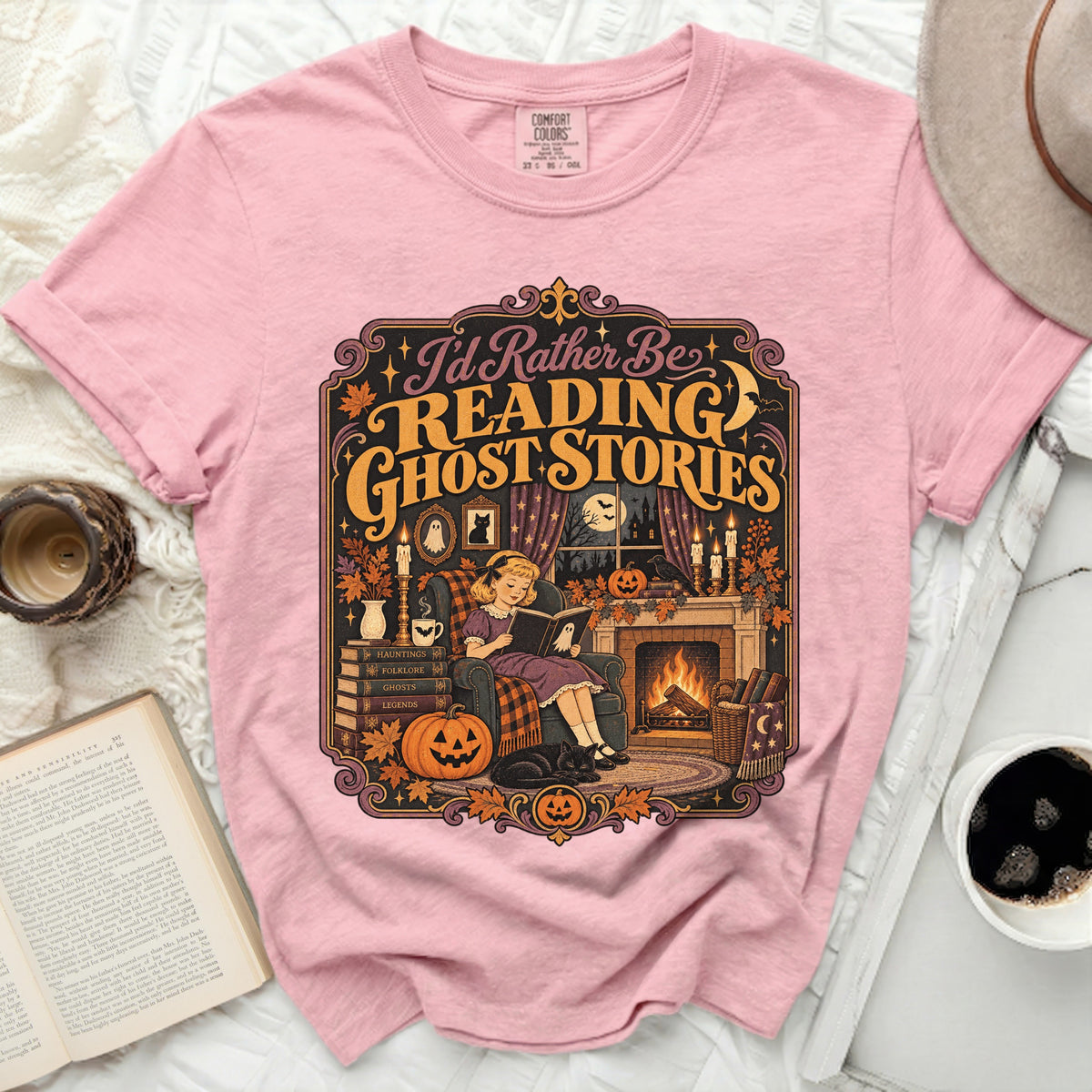 Pink t-shirt with "I'd Rather Be Reading Ghost Stories" graphic.