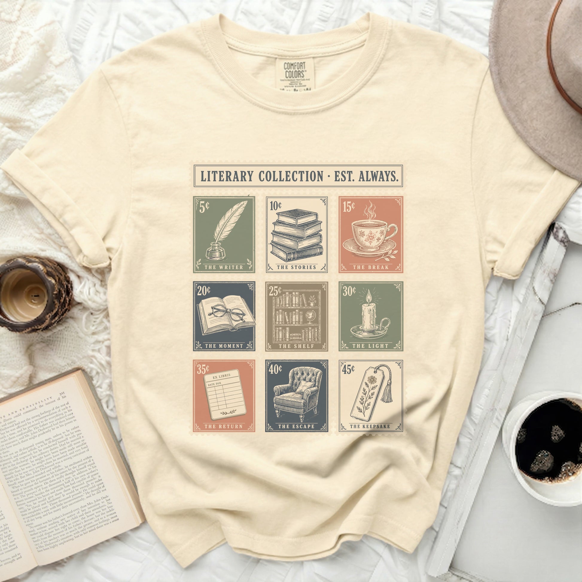 Cream t-shirt with literary collection stamp graphics and text.
