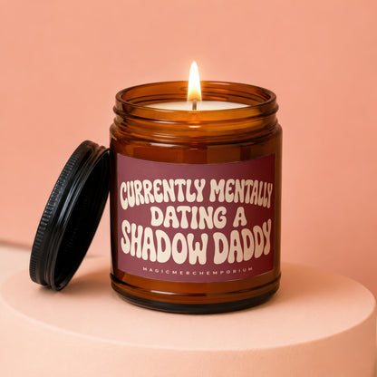 Amber jar candle with black lid and "Currently Mentally Dating A Shadow Daddy" label.