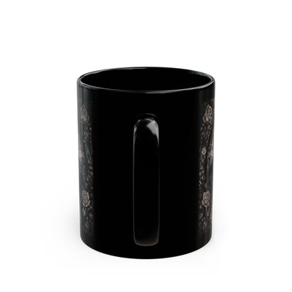 Black mug with intricate floral pattern on both sides.