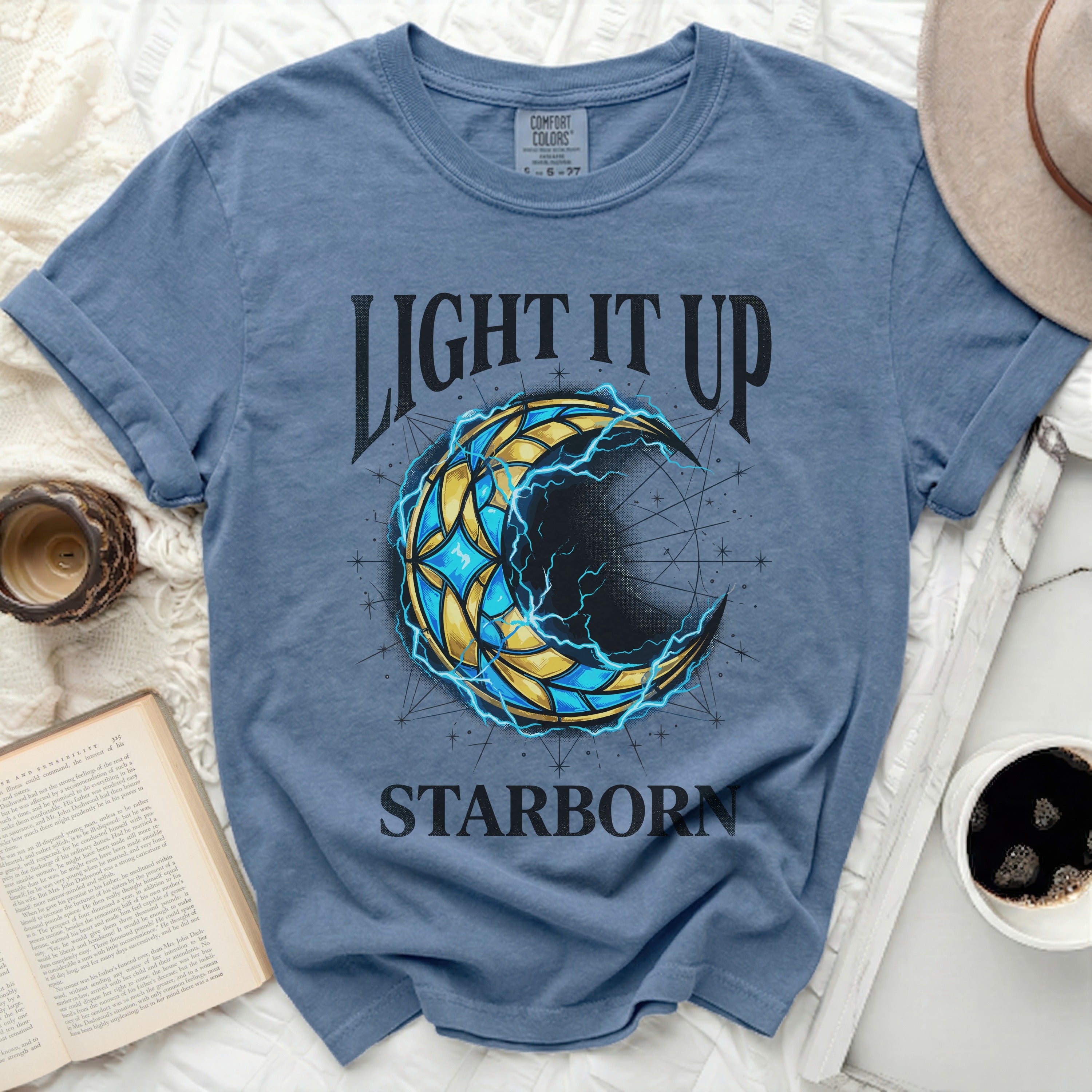 Blue t-shirt with a celestial moon graphic and 