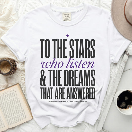 White t-shirt with text "To the Stars who listen & The Dreams That Are Answered"