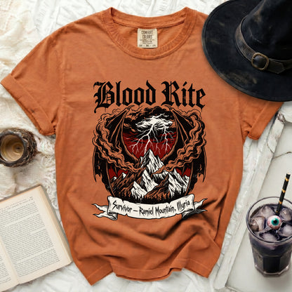 Orange t-shirt with "Blood Rite" and dragon/mountain graphic.