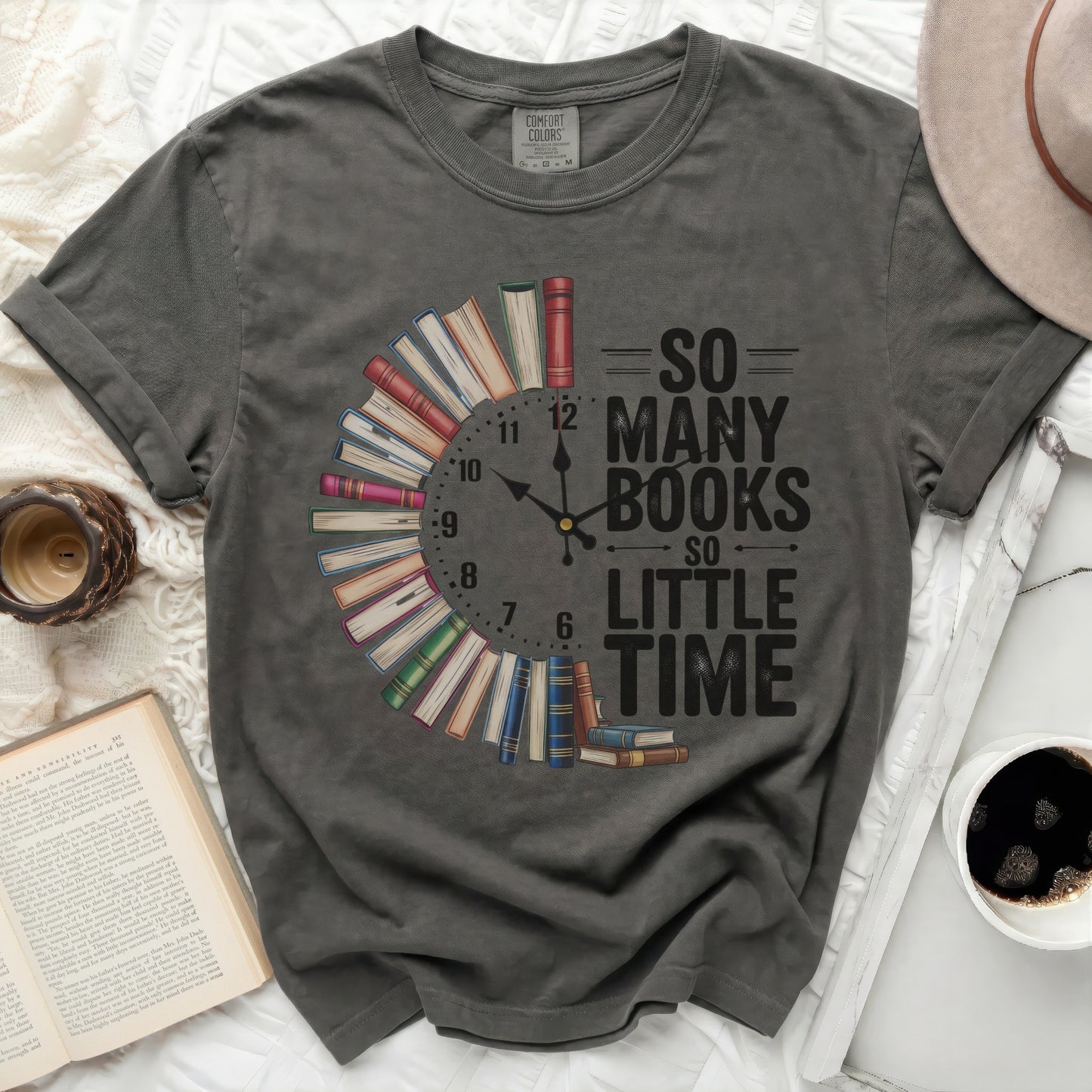 Dark t-shirt with a clock made of books and text "So Many Books So Little Time".