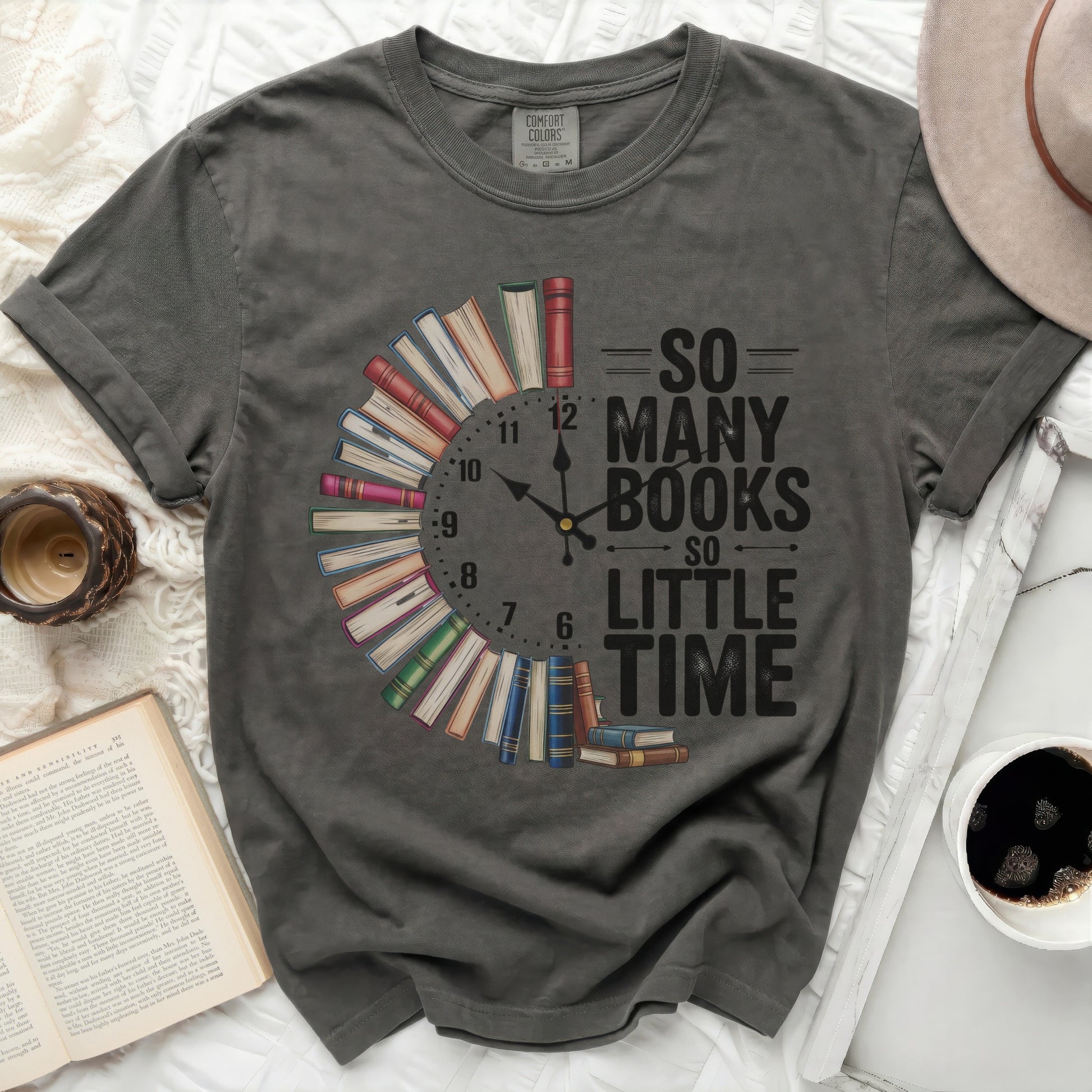 Dark t-shirt with a clock made of books and text "So Many Books So Little Time".