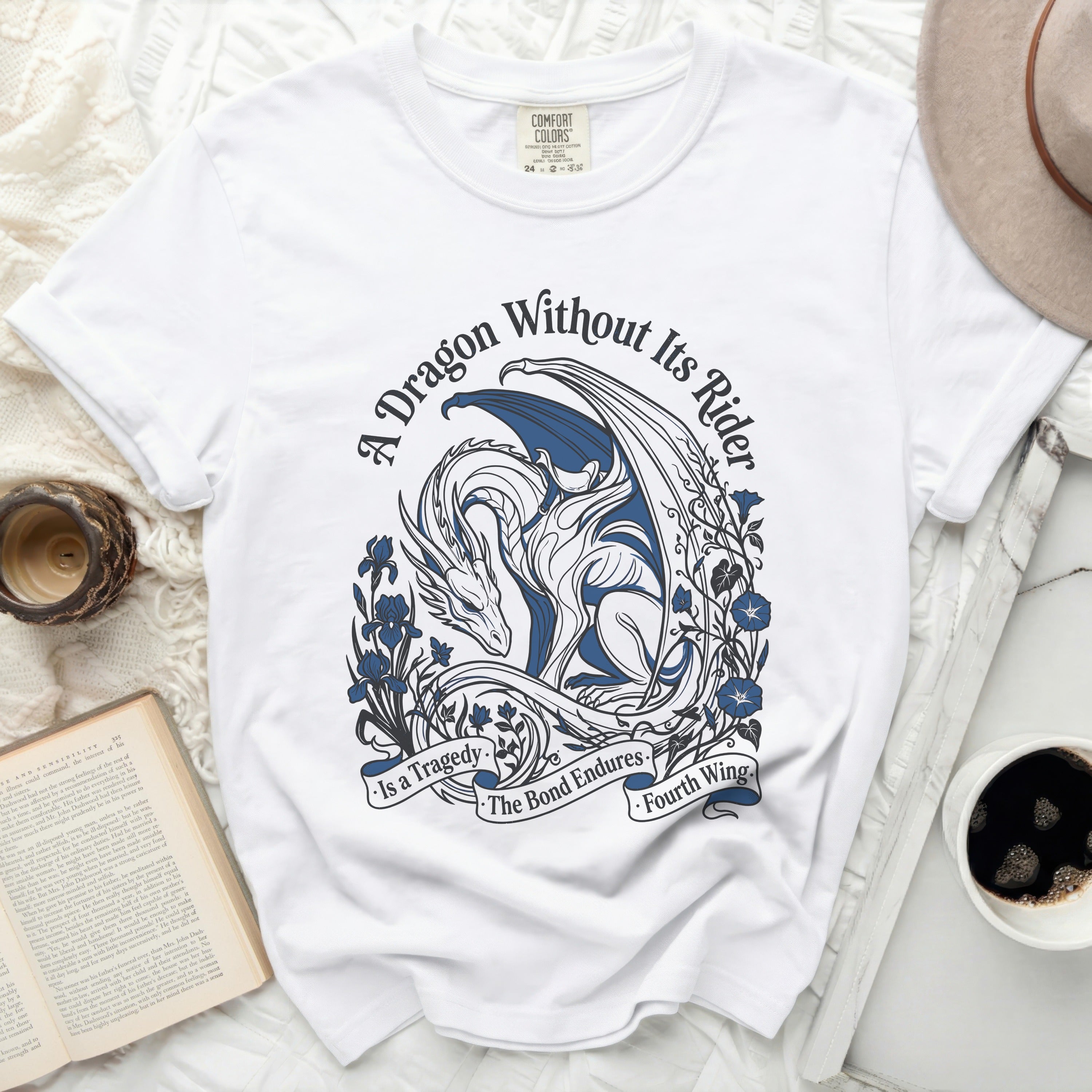 White t-shirt with a blue dragon and floral design, reading 