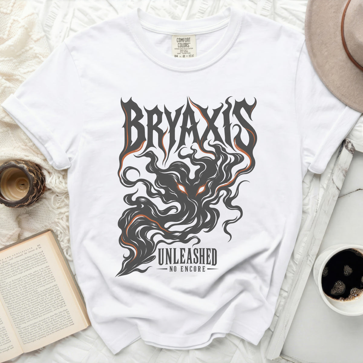 White t-shirt with "BRYAXIS UNLEASHED NO ENCORE" text and graphic design.