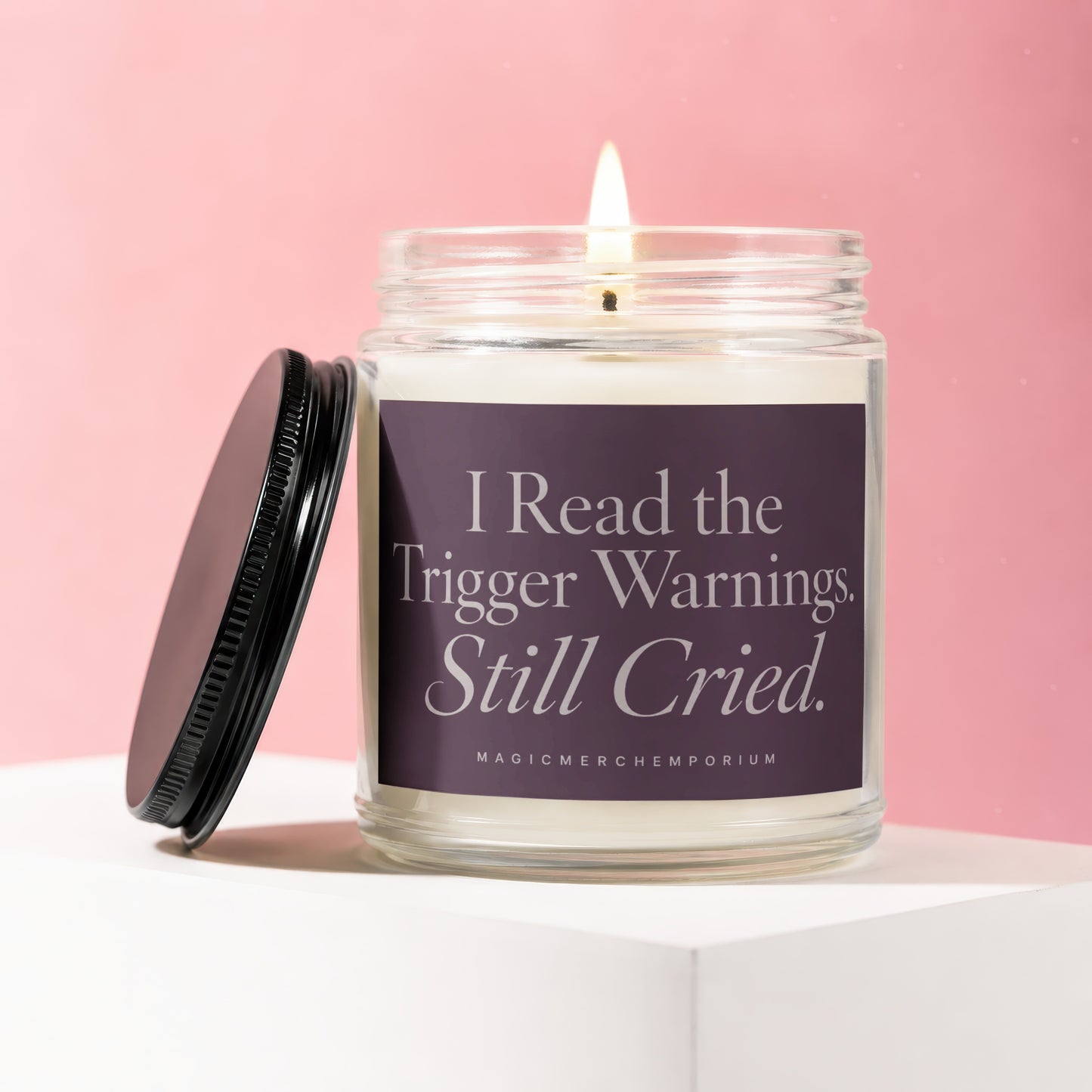 Candle with text "I Read the Trigger Warnings. Still Cried." on purple label.