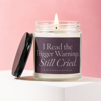 Candle with text "I Read the Trigger Warnings. Still Cried." on purple label.
