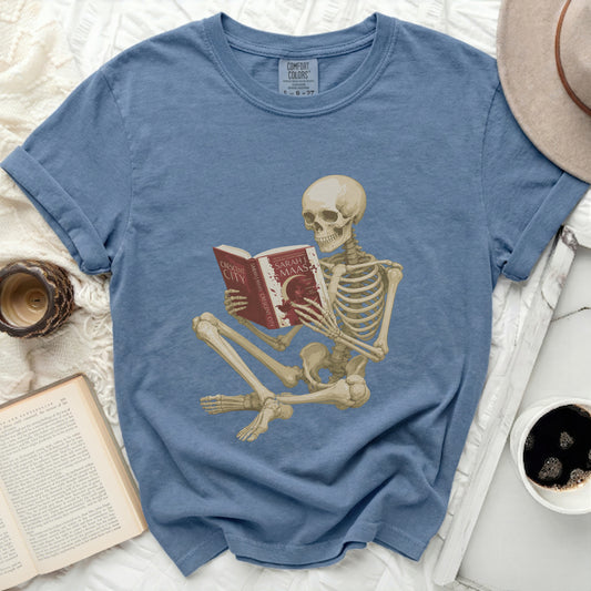 Skeleton reading "Crescent City: House of Earth and Blood" by Sarah J. Maas.