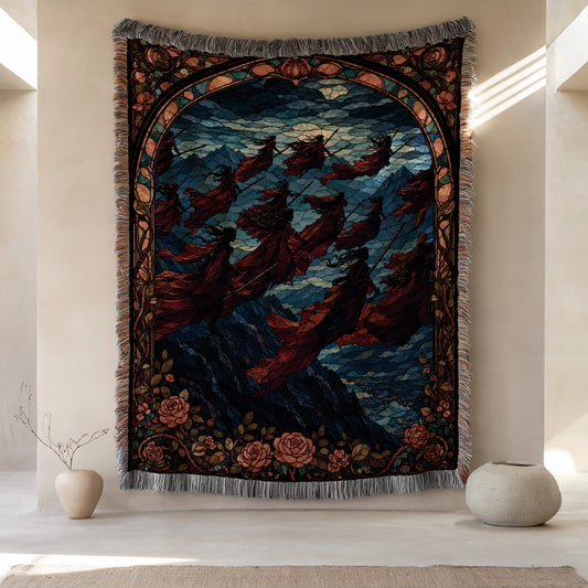a large tapestry hanging on a wall, depicting a scene with a group of people and a landscape with mountains in the background. The tapestry is framed by a decorative border and has a floral pattern. There are two small vases placed on either side of the tapestry, and the overall color scheme of the image is predominantly red, blue, and green.