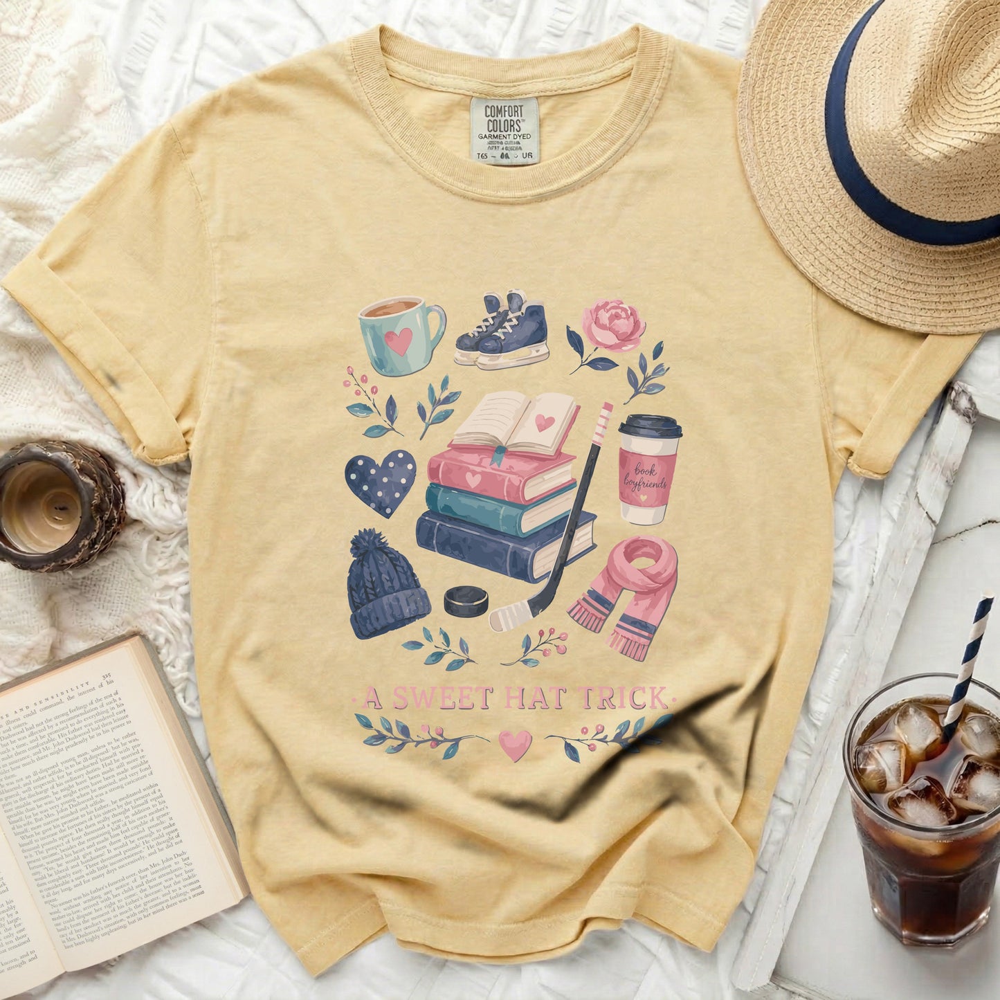 Yellow t-shirt with bookish winter and coffee graphics and text.