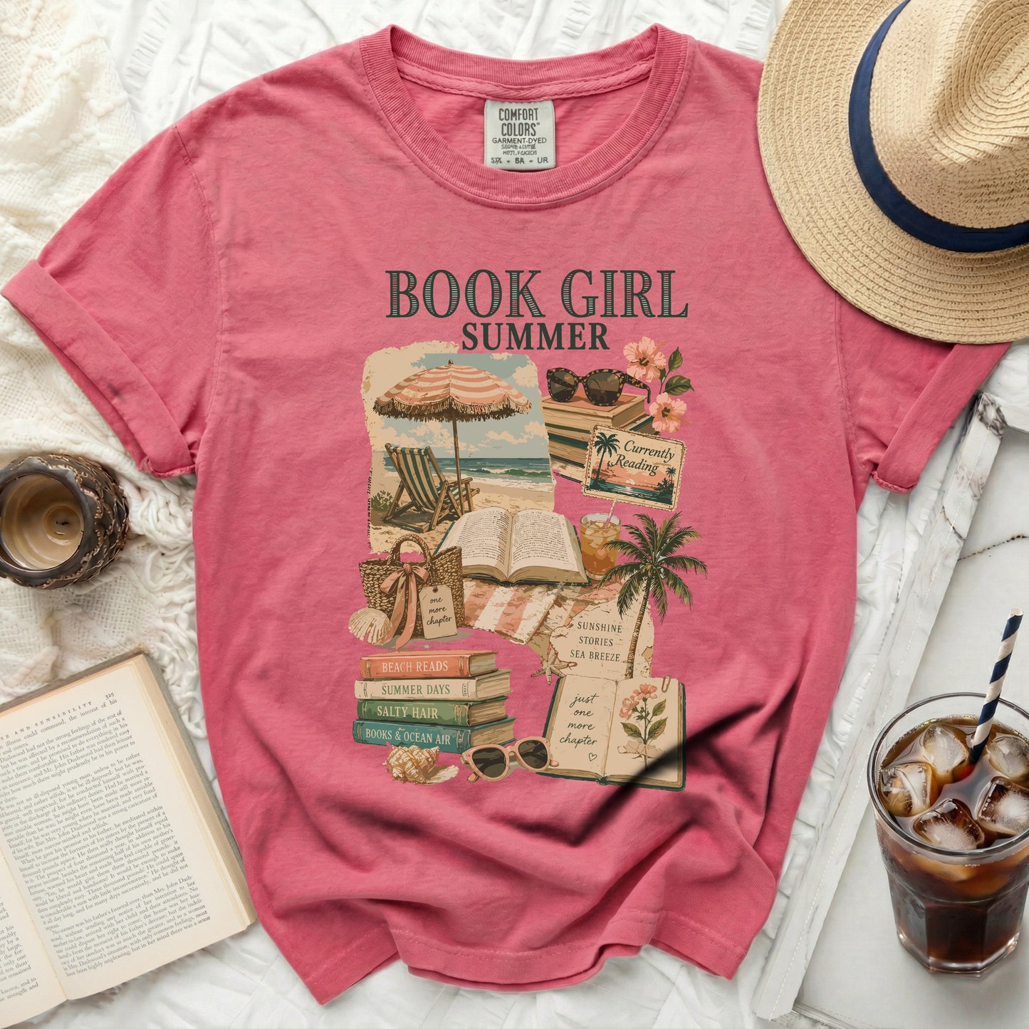 Pink t-shirt with "BOOK GIRL" graphic and beach-themed illustrations.