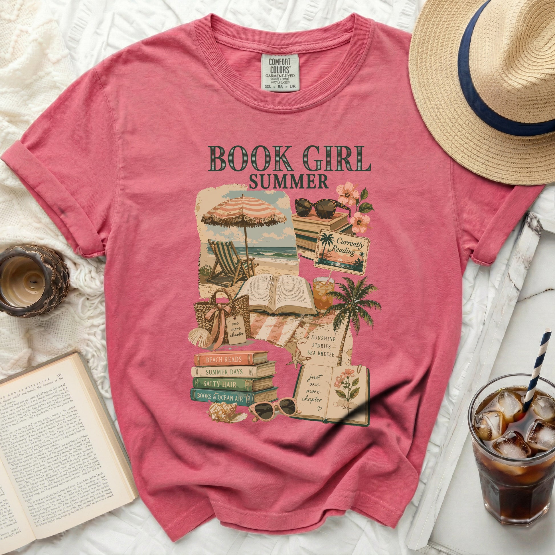 Pink t-shirt with "BOOK GIRL" graphic and beach-themed illustrations.