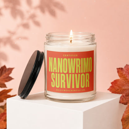 Candle with "Certified Nanowrimo Survivor" text on an orange label.