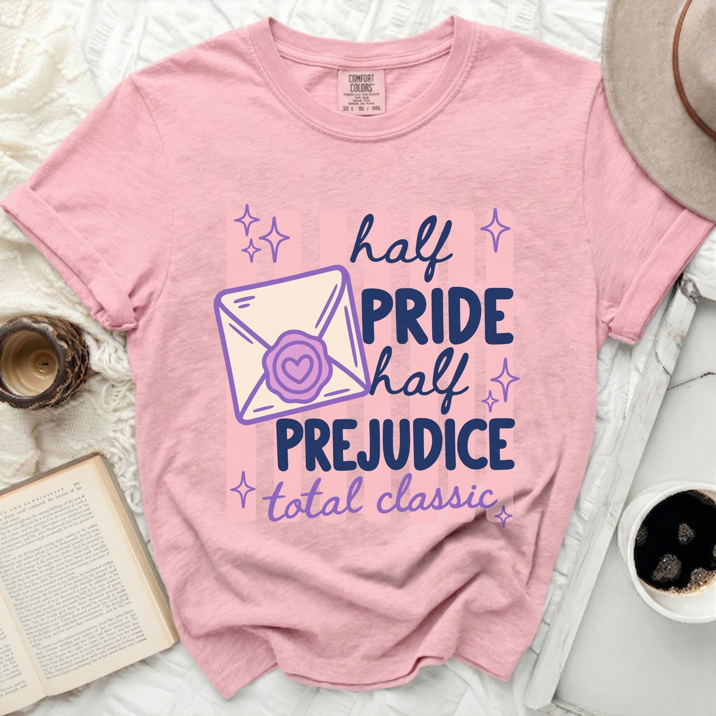 Pink t-shirt with "half PRIDE half PREJUDICE total classic" graphic.