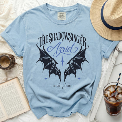 Light blue t-shirt with "The Shadowsinger Azriel Night Court" graphic and wings.