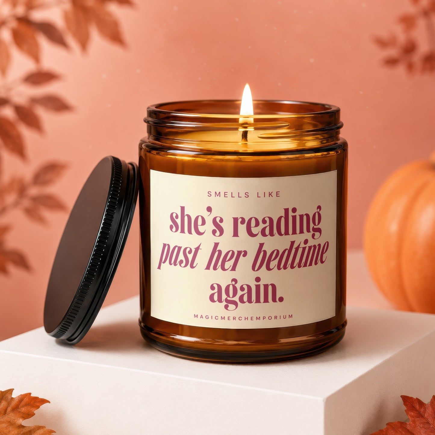 Amber jar candle with text "she's reading past her bedtime again."