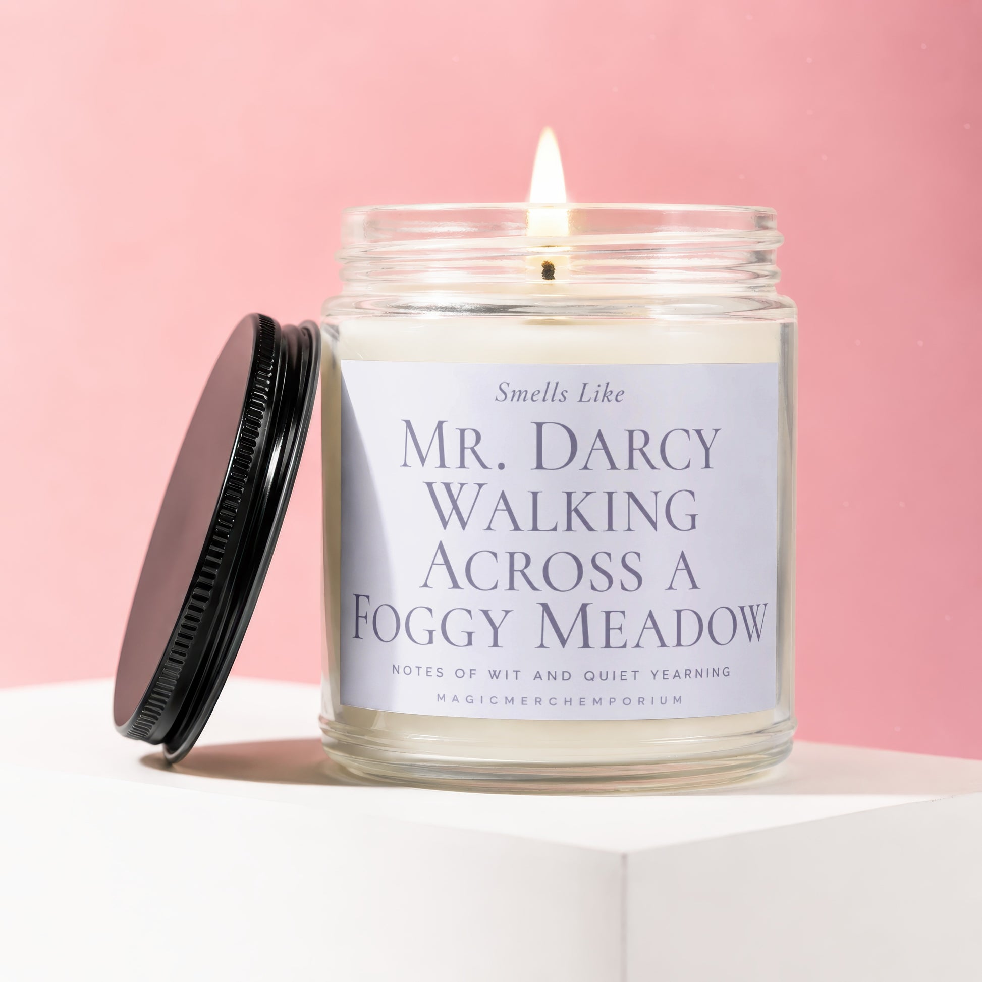 Glass jar candle with "Mr. Darcy Walking Across a Foggy Meadow" label.