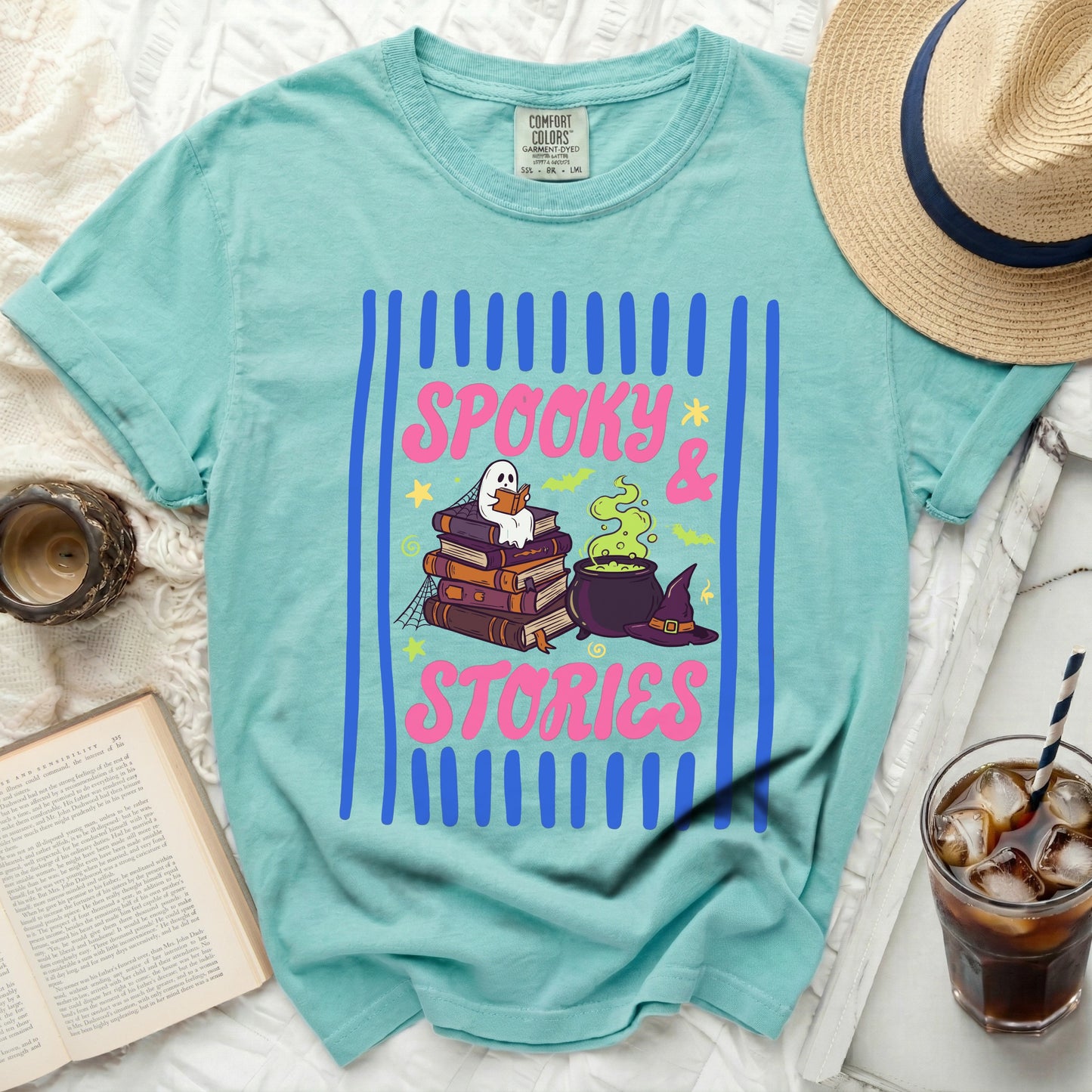Teal t-shirt with "Spooky & Stories" graphic and ghost reading books.