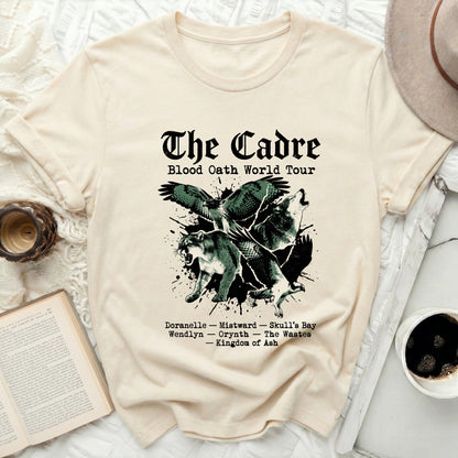 Cream t-shirt with "The Cadre Blood Oath World Tour" text and graphic.