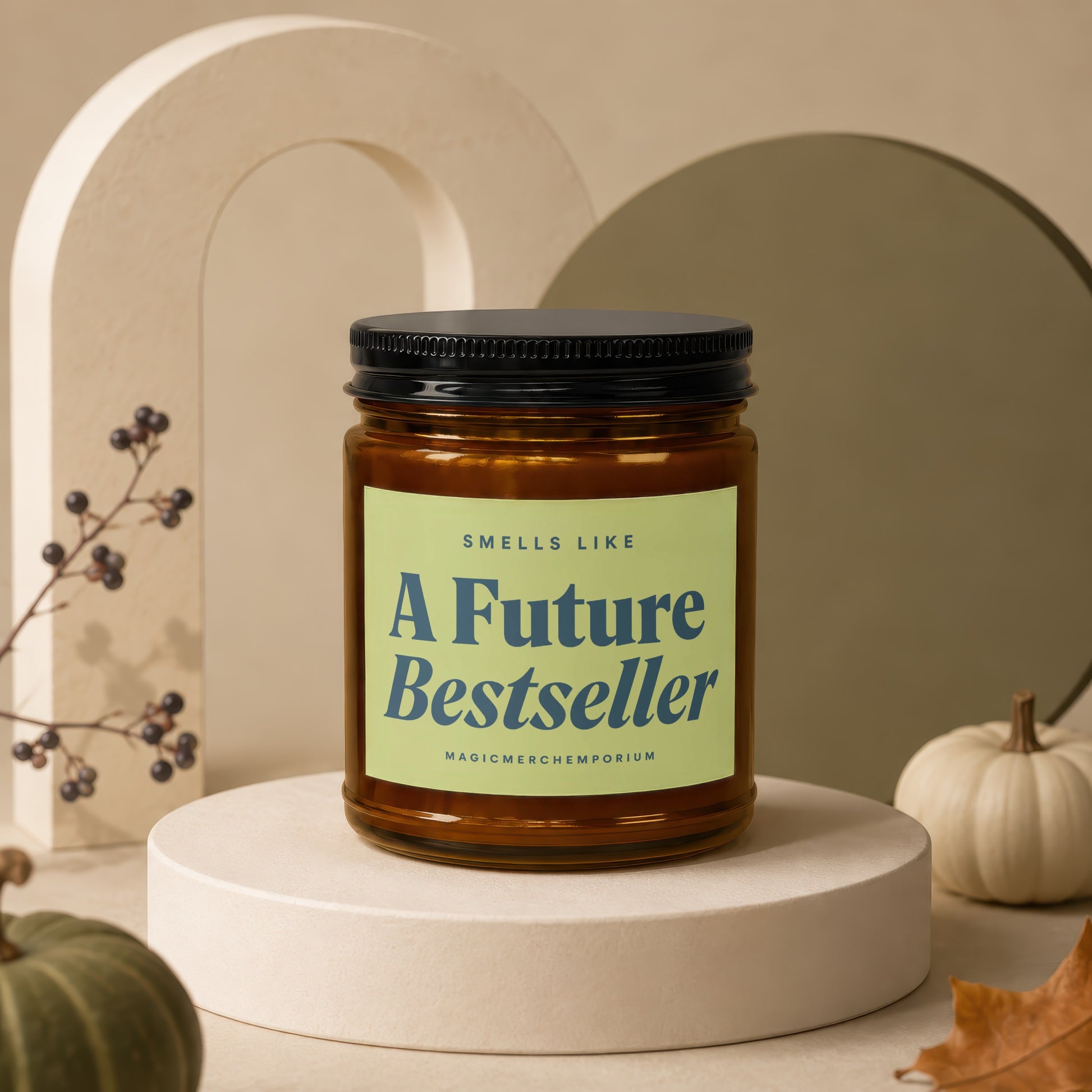 Amber glass candle with black lid reading "A Future Bestseller."
