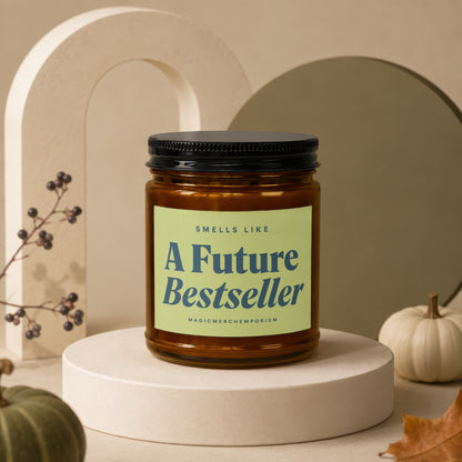 Amber glass candle with black lid reading "A Future Bestseller."