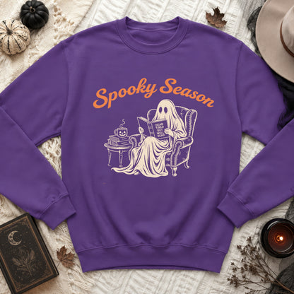 Purple sweatshirt with graphic of ghost reading, "Spooky Season" and "Dead Tired But Well Read".