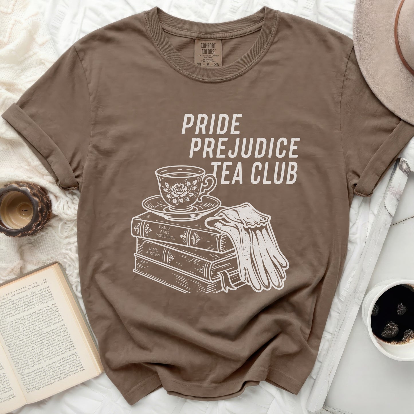 Brown t-shirt with "Pride Prejudice Tea Club" graphic.