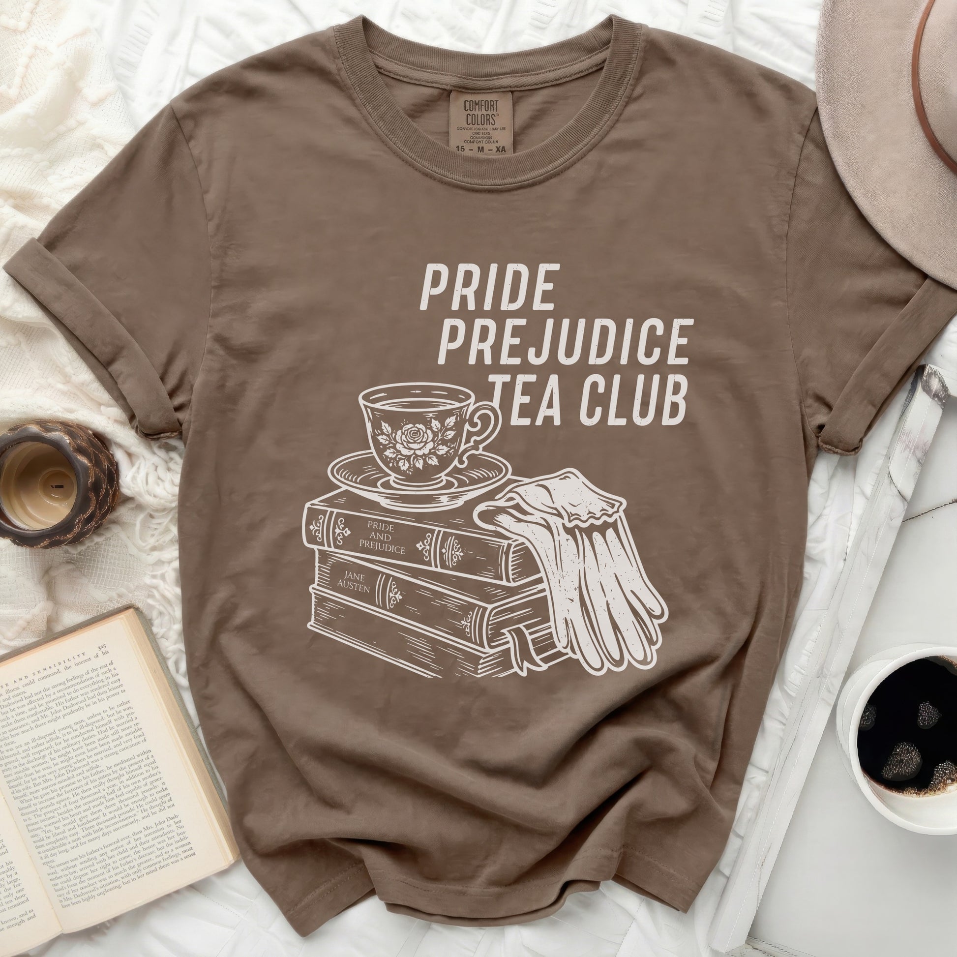Brown t-shirt with "Pride Prejudice Tea Club" graphic.