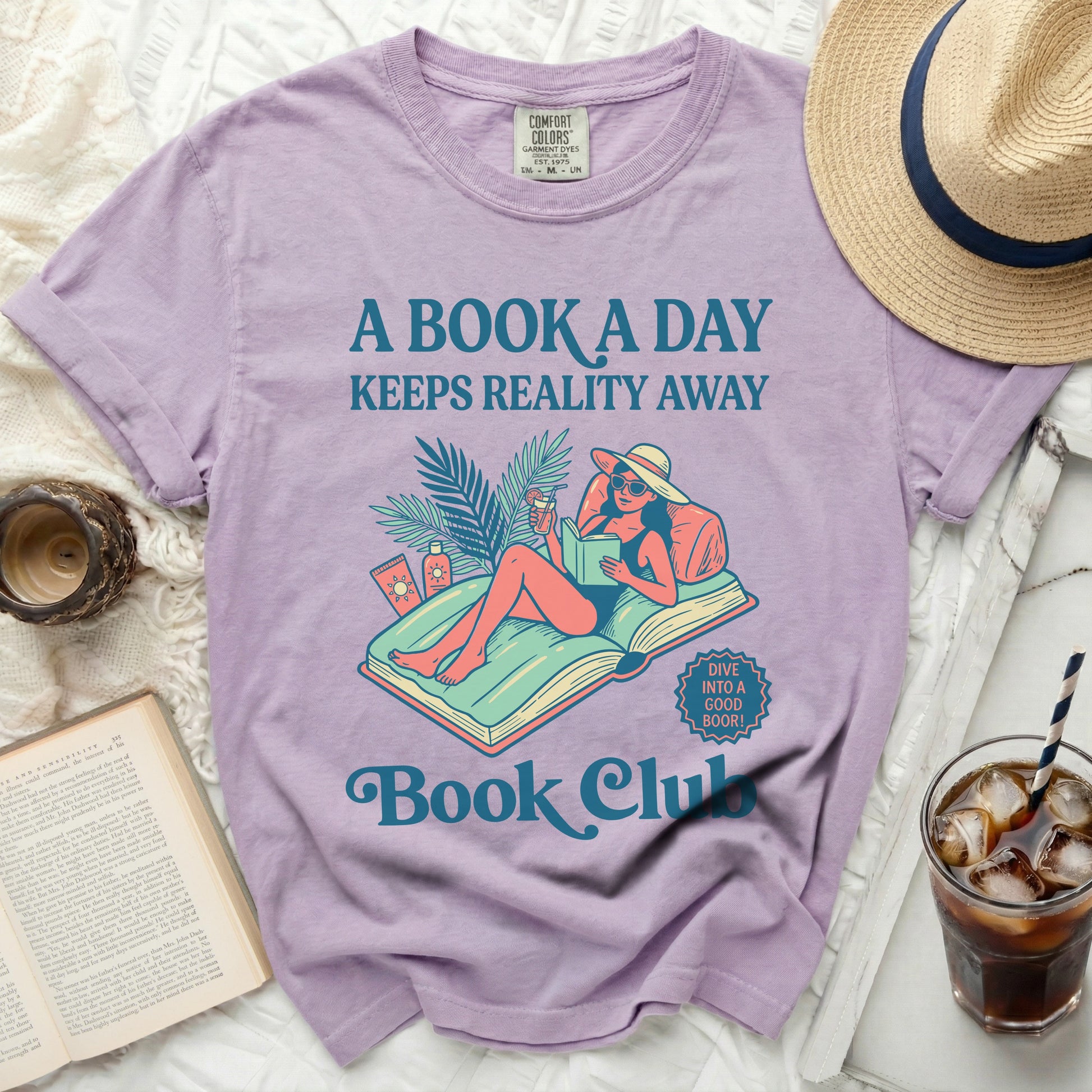 T-shirt with "A Book a Day Keeps Reality Away" and book club graphic.