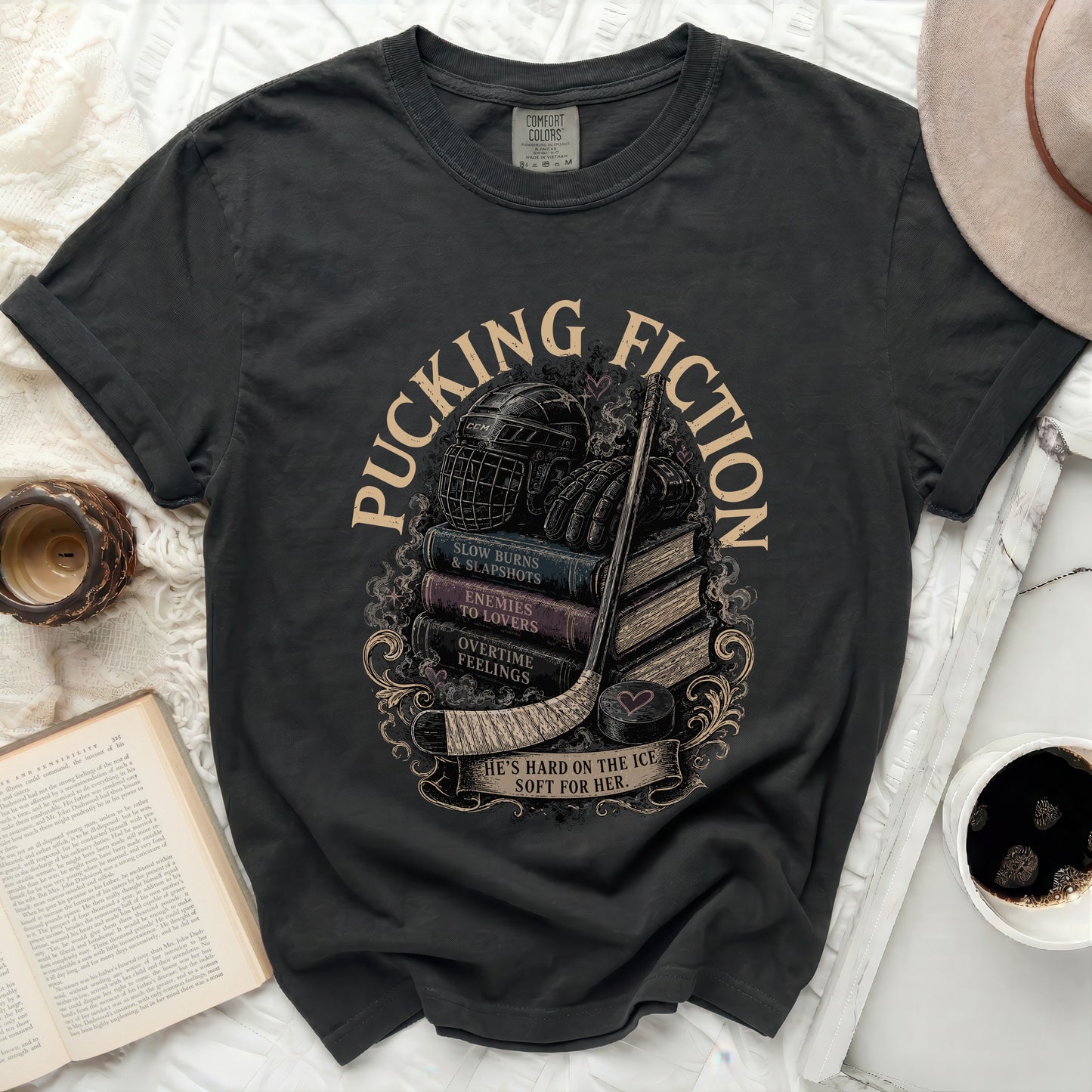 Dark t-shirt with "Pucking Fiction" and romance novel tropes.