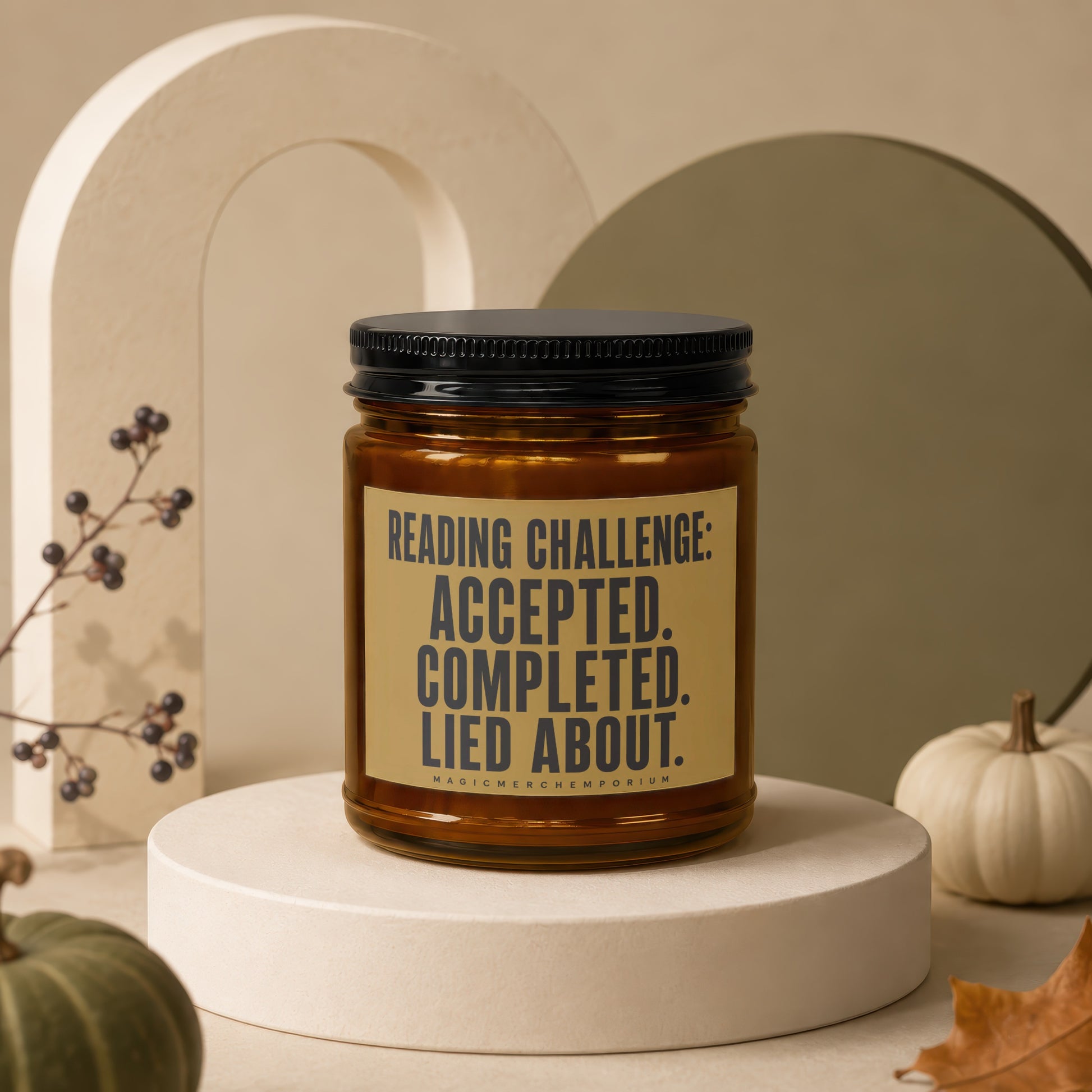 Amber candle with black lid, label reads "READING CHALLENGE: ACCEPTED. COMPLETED. LIED ABOUT."