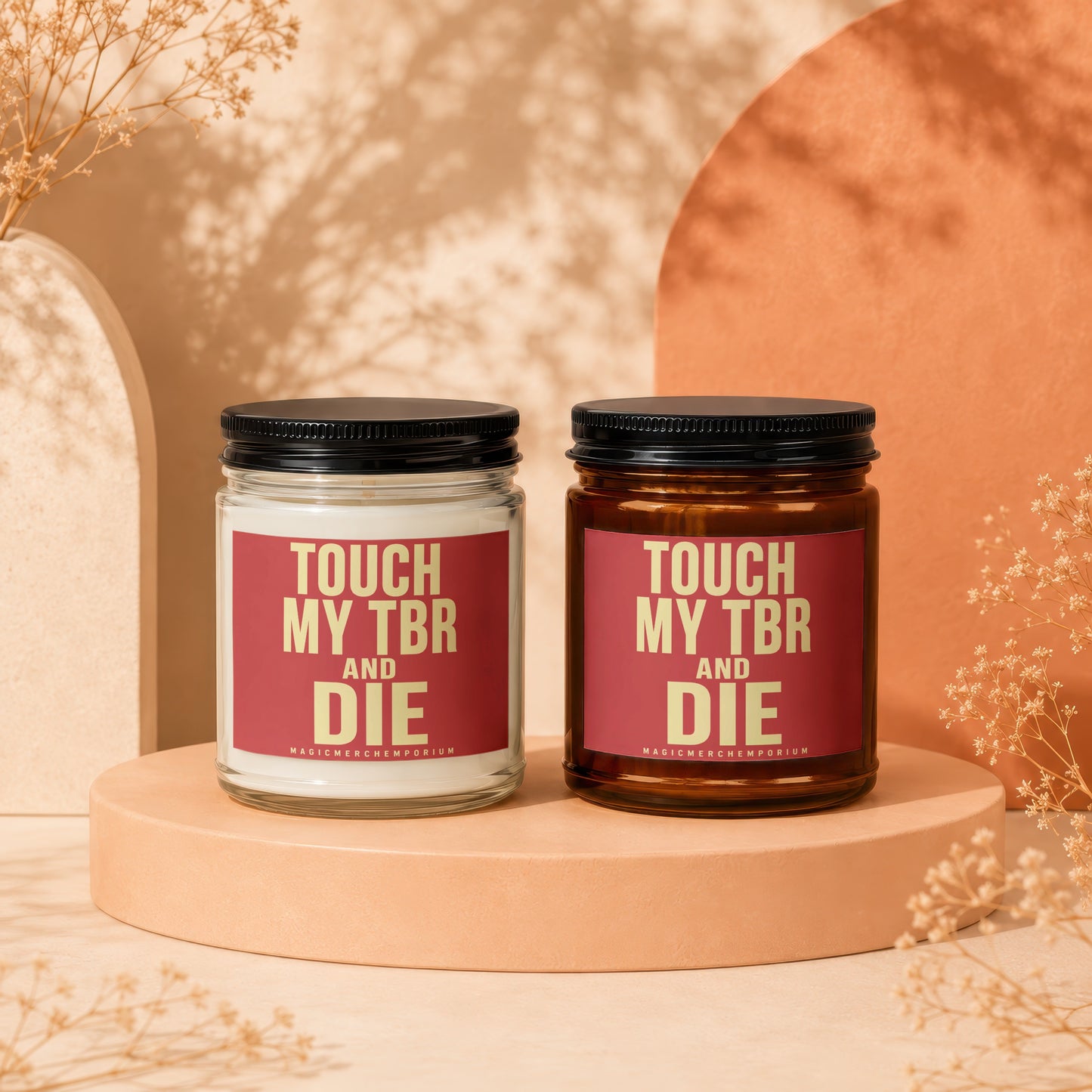 Two candles with "TOUCH MY TBR AND DIE" text on red labels.