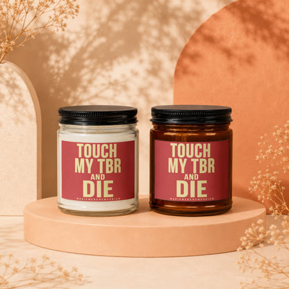 Two candles with "TOUCH MY TBR AND DIE" text on red labels.