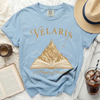 Light blue t-shirt with "Velaris A Chapter of Starlight" and a mountain castle design.