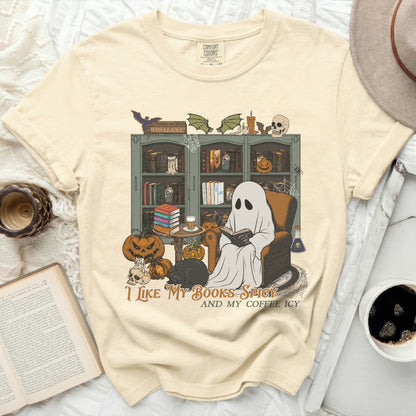 Ghost reading with pumpkins, a black cat, and the text "I like my books spicy and my coffee icy."