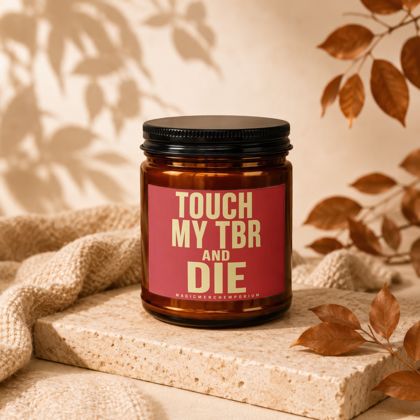 Amber candle with a red label reading "TOUCH MY TBR AND DIE".