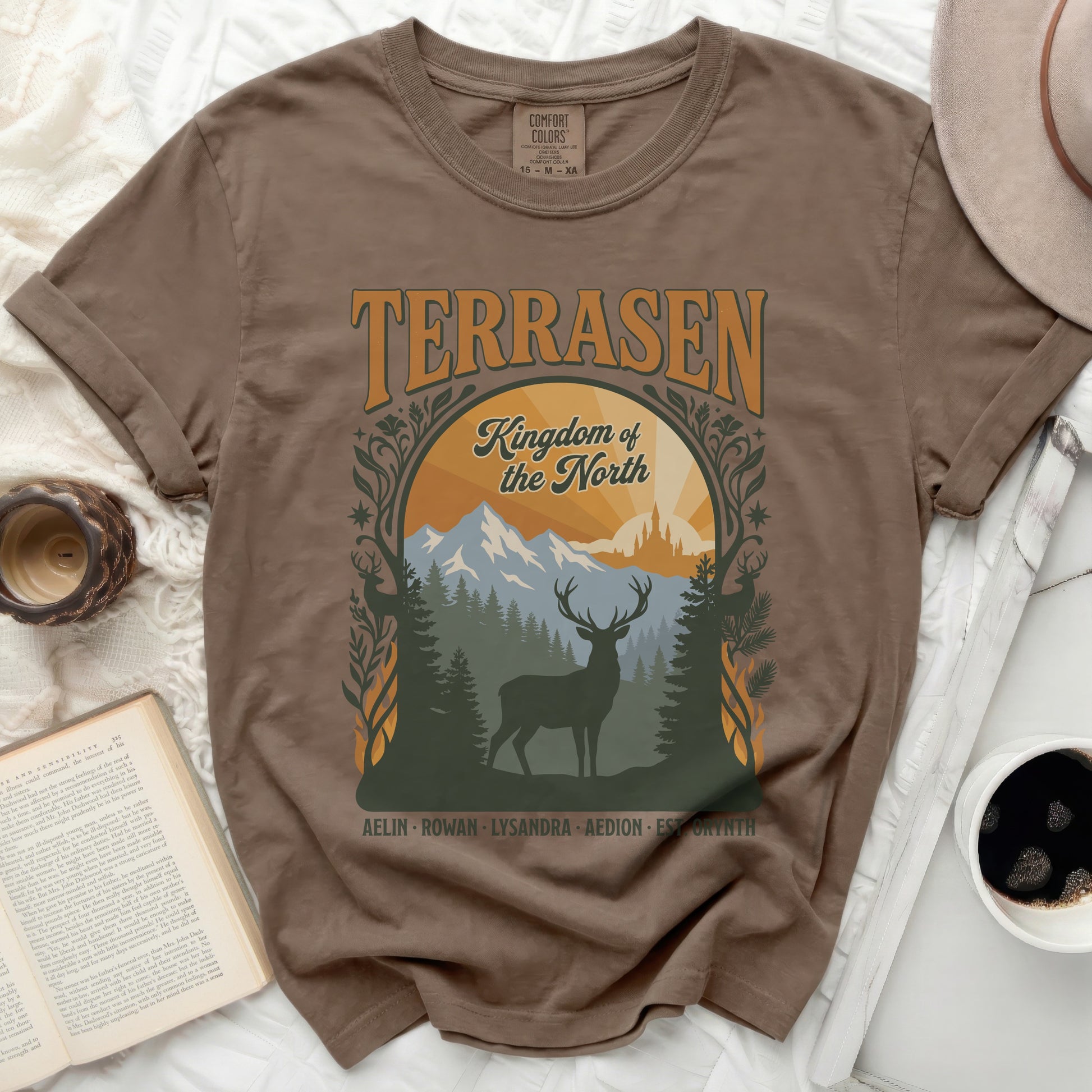 Brown t-shirt with Terrasen Kingdom of the North deer forest graphic.