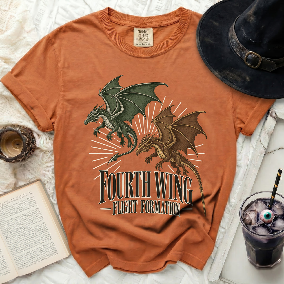 Orange t-shirt featuring a green and a brown dragon graphic with the text Fourth Wing Flight Formation.