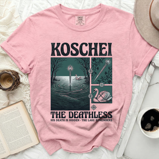 Pink t-shirt with "KOSCHEI THE DEATHLESS HIS DEATH IS HIDDEN THE LAKE REMEMBERS" graphic.